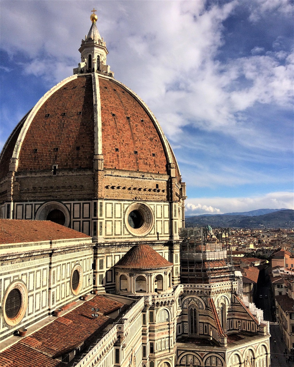 Florence Cathedral dome in Italy under a bright blue sky, symbolizing culture and travel experiences with Fight & Travel